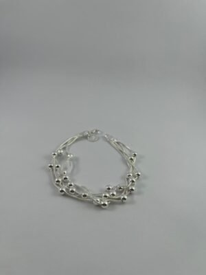 2025/10/IMG-20251009-WA0012.jpg Pulsera Retorcida de cuencas de plata de ley